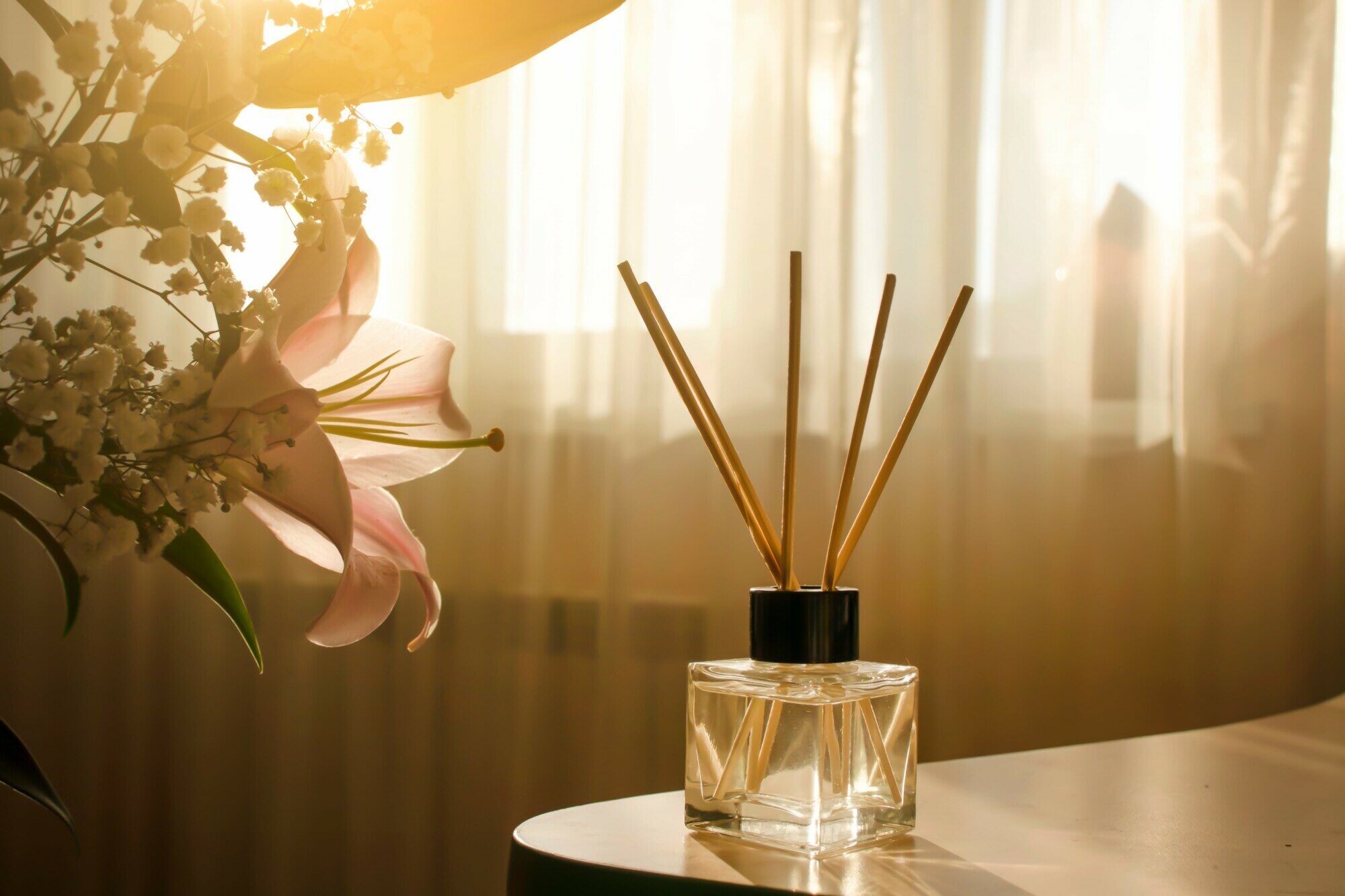 homemade-reed-diffuser homemade reed diffuser filled with oil on table